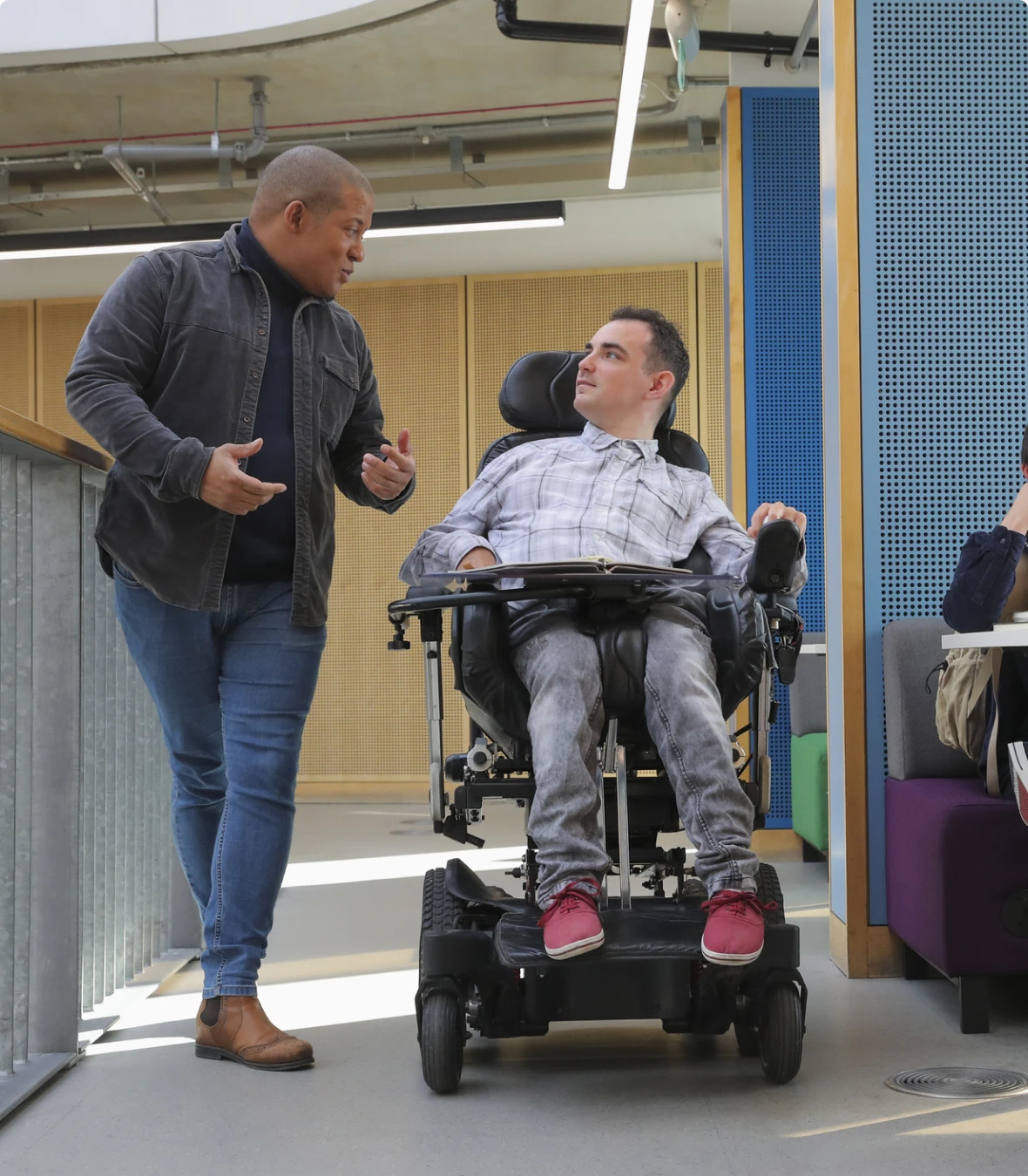 Two men talking in modern building