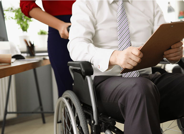 Businessman in wheelchair at desk